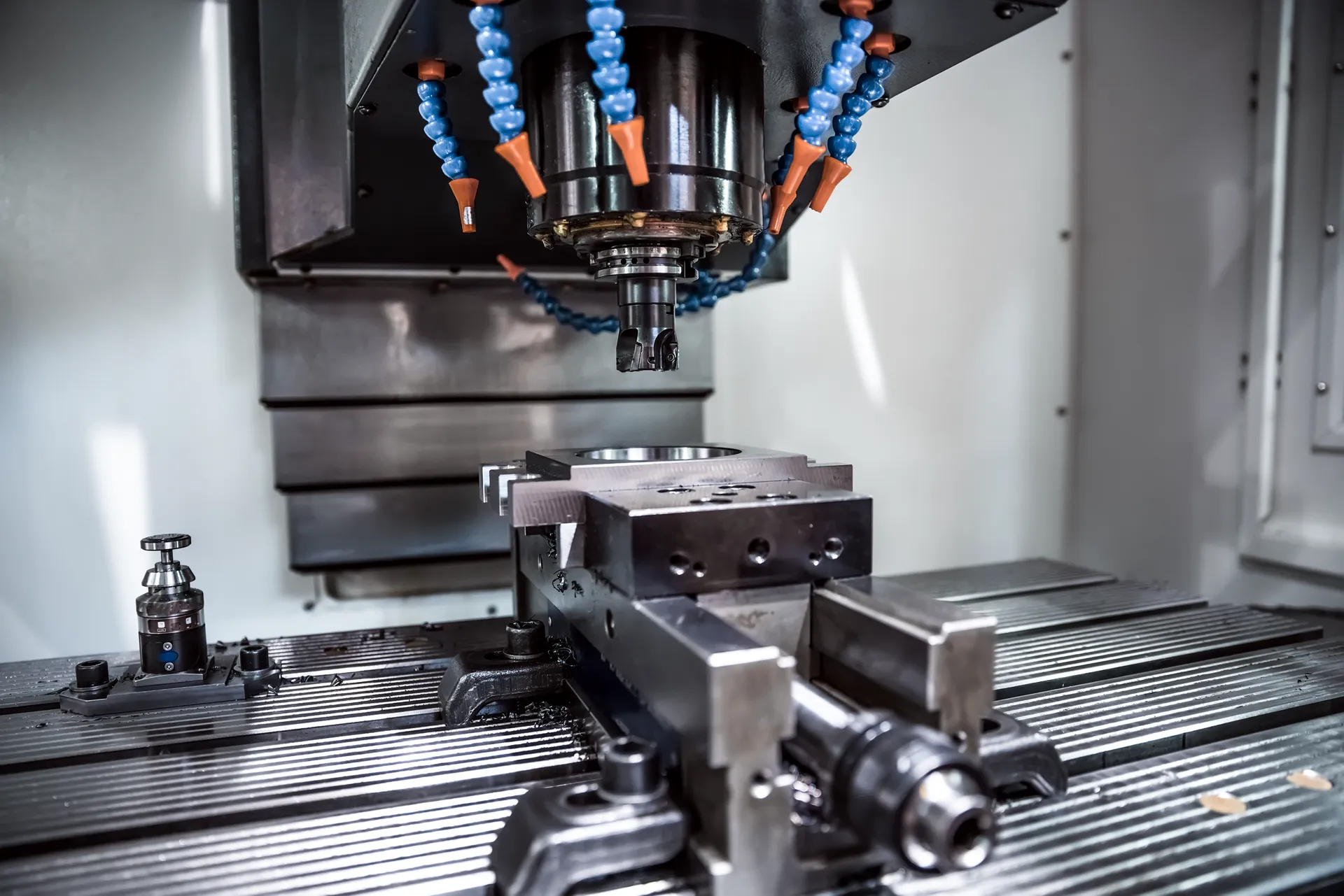 Vertical CNC milling centre machining a complex part